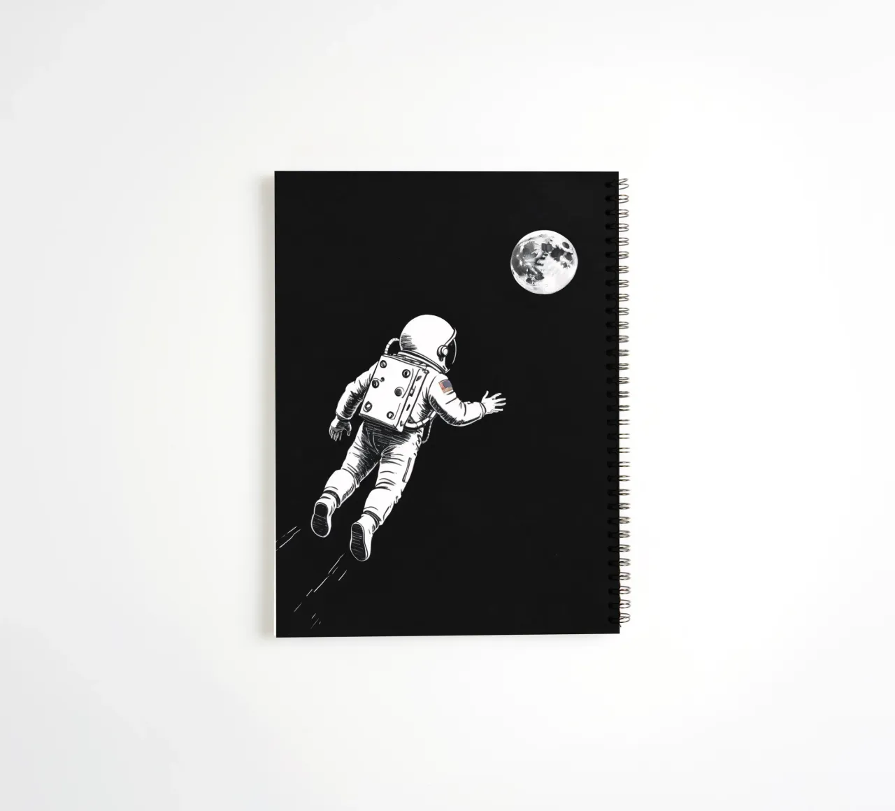 Astronaut floating towards the moon in a dark space spiral notebook by DesignDoodle