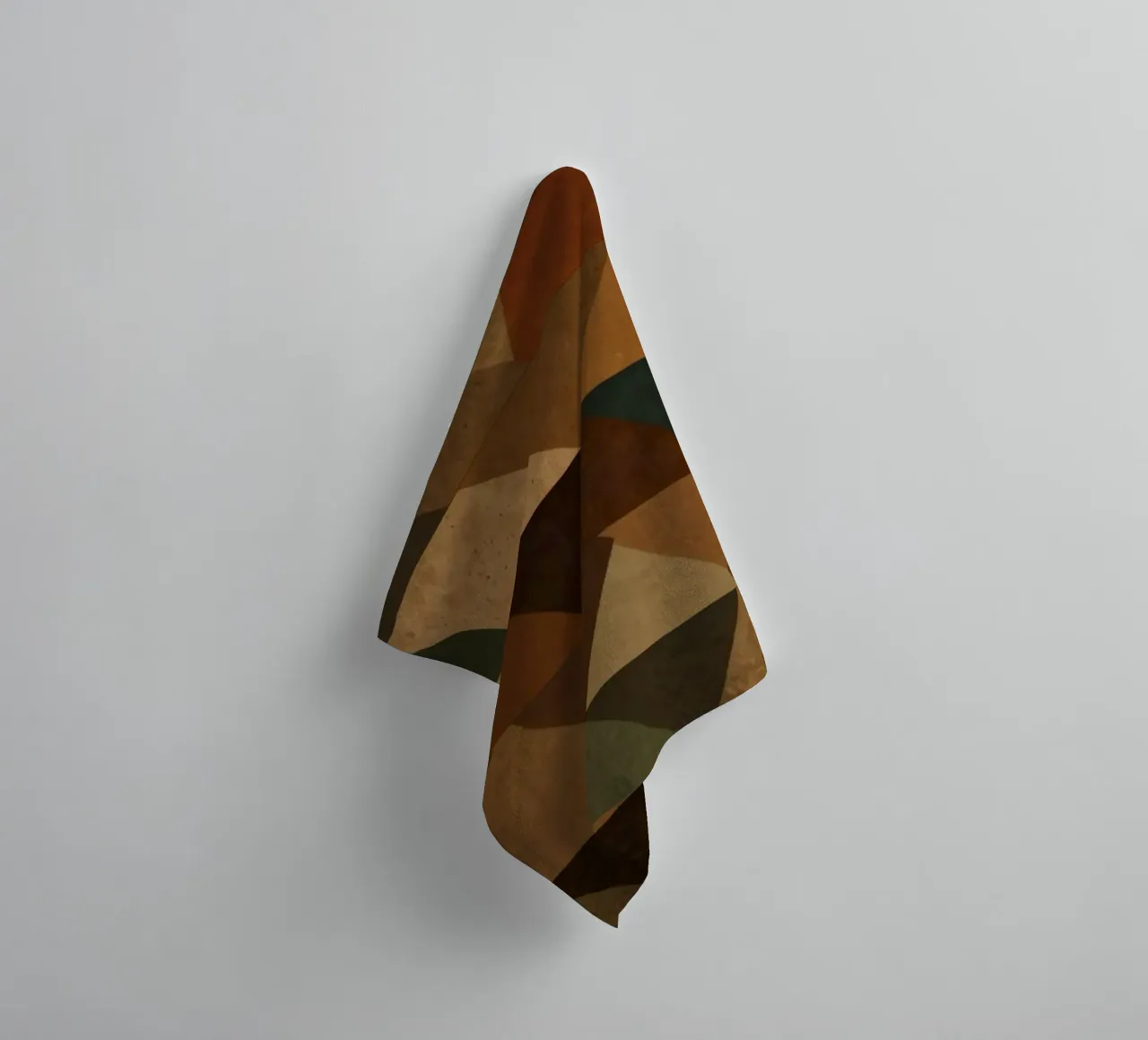 A geometric pattern of triangles in earthy tones arranged towel by DesignDoodle