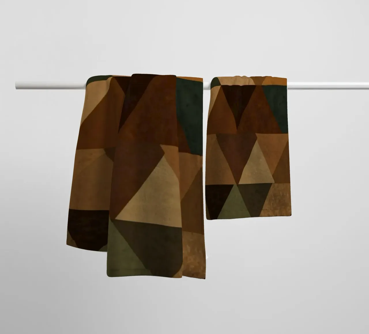 A geometric pattern of triangles in earthy tones arranged towel by DesignDoodle