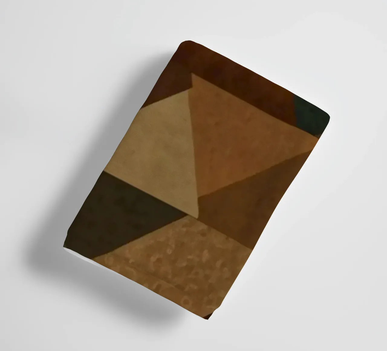 A geometric pattern of triangles in earthy tones arranged towel by DesignDoodle