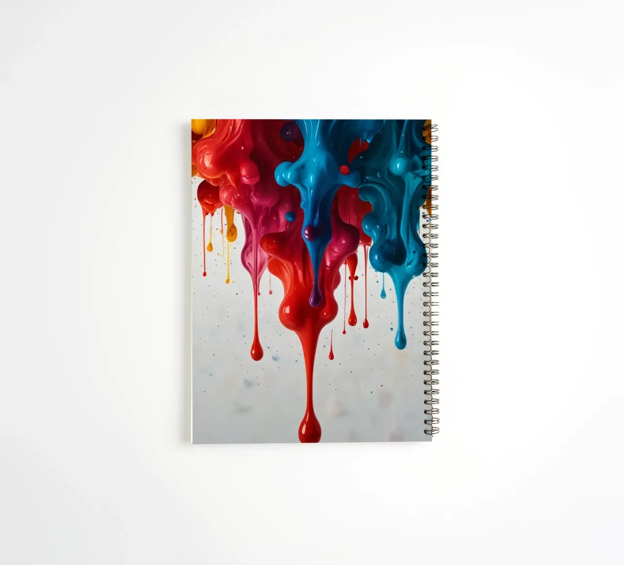 Vibrant paint drips cascading down a white surface creating spiral notebook by DesignDoodle