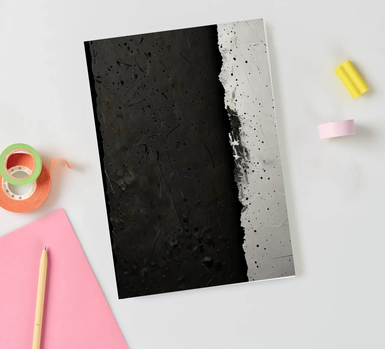 split in textured dark surfaces reveals an unexpected light notebook by DesignDoodle