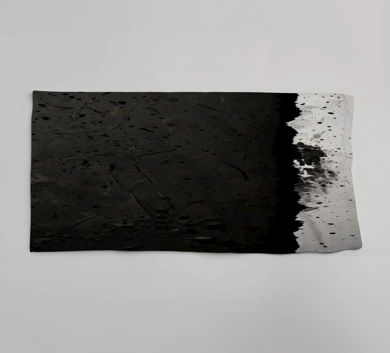 split in textured dark surfaces reveals an unexpected light towel by DesignDoodle