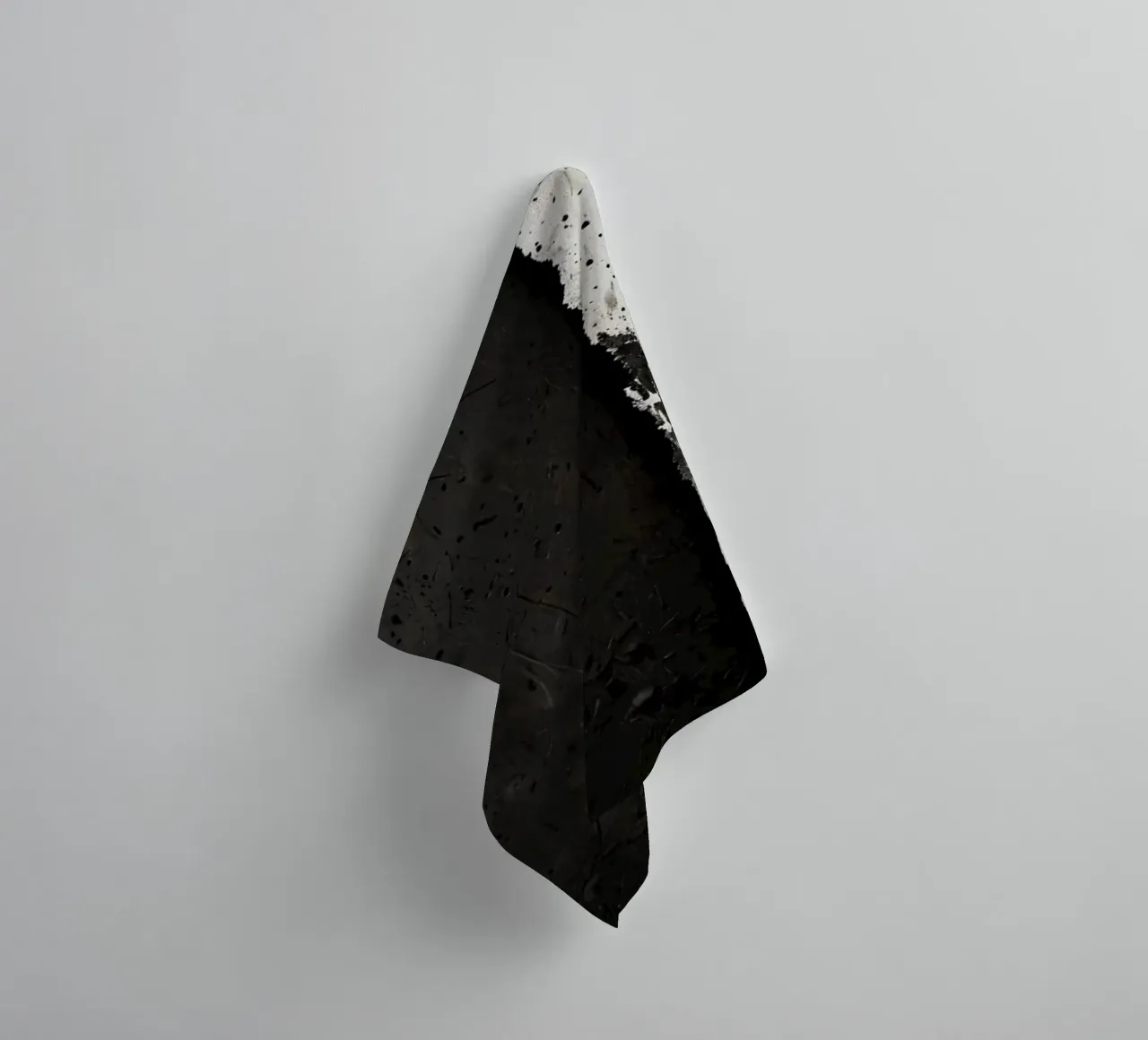 split in textured dark surfaces reveals an unexpected light towel by DesignDoodle