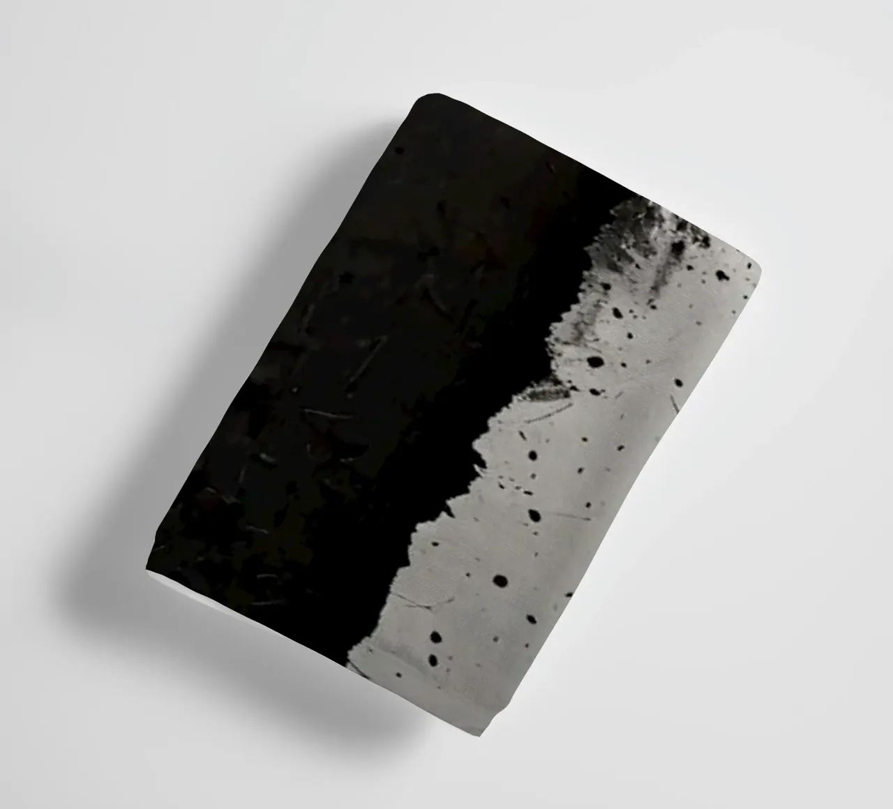 split in textured dark surfaces reveals an unexpected light towel by DesignDoodle