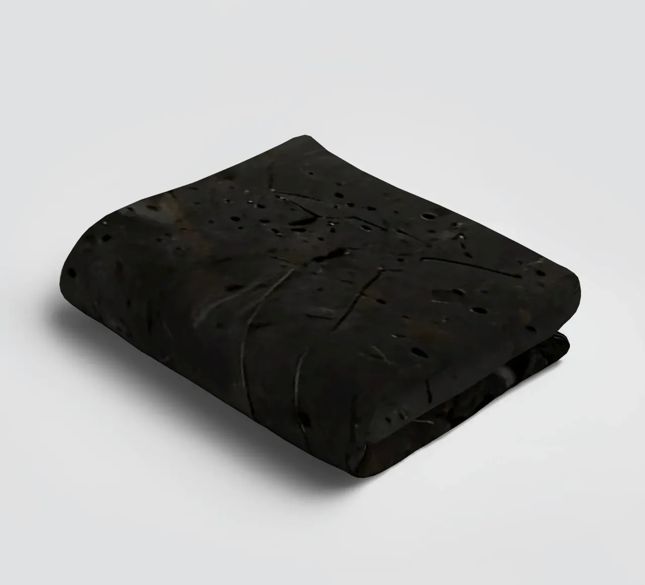 split in textured dark surfaces reveals an unexpected light towel by DesignDoodle