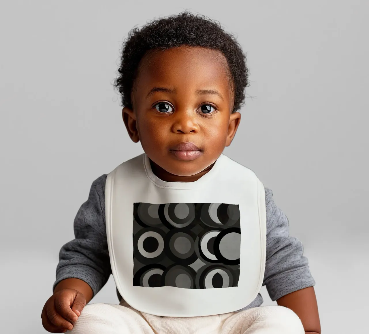 Abstract pattern of overlapping circles in various shades of baby bib by DesignDoodle