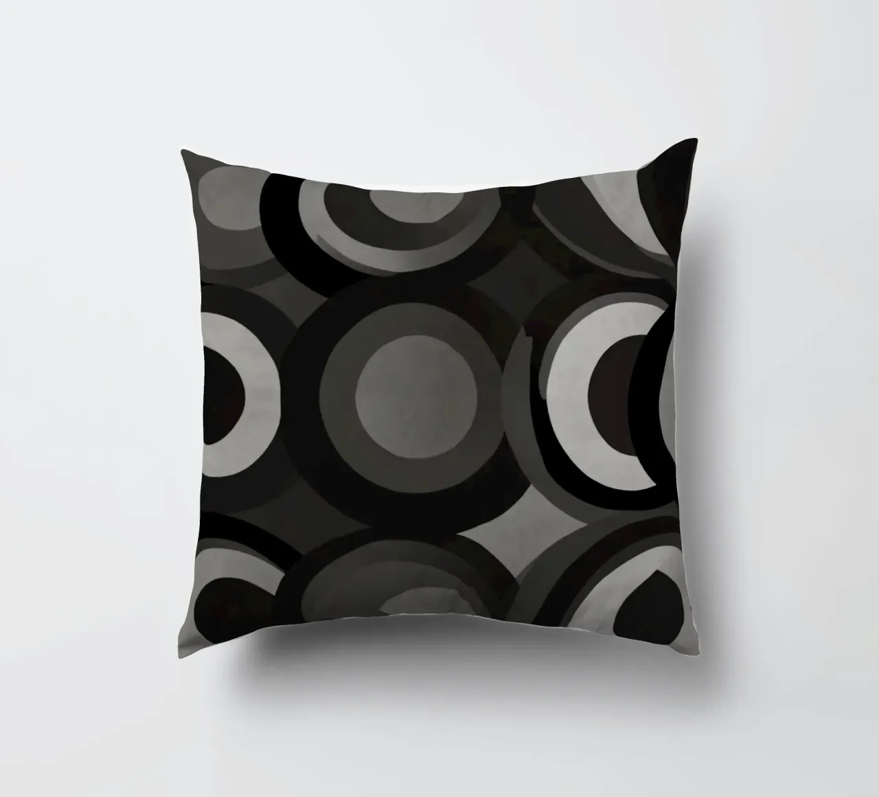Abstract pattern of overlapping circles in various shades of decorative cushion by DesignDoodle