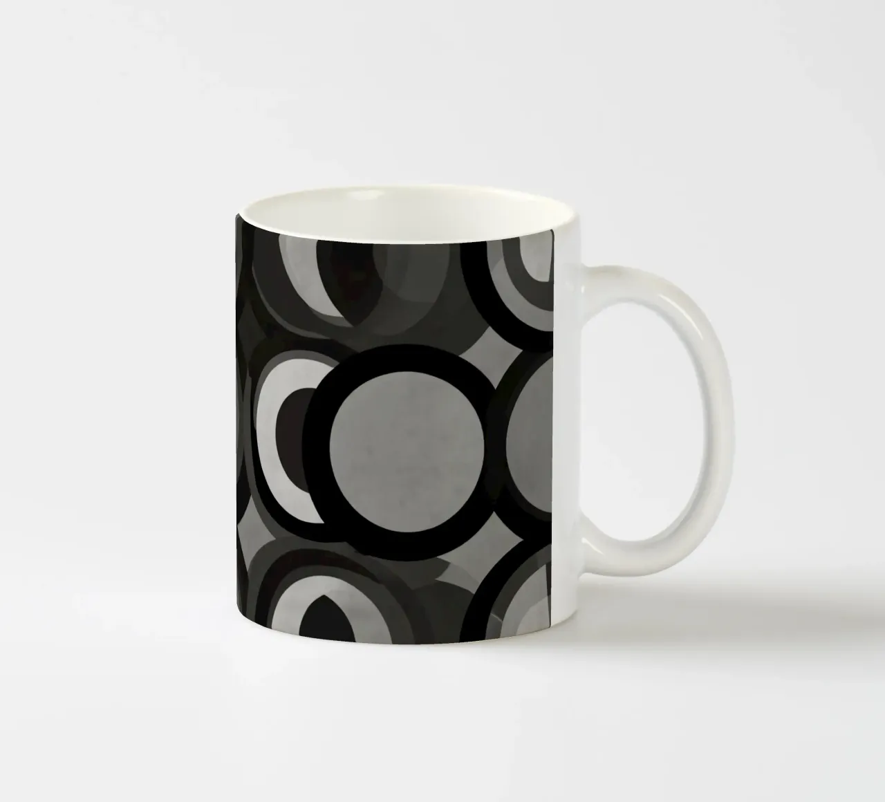 Abstract pattern of overlapping circles in various shades of ceramic mug by DesignDoodle