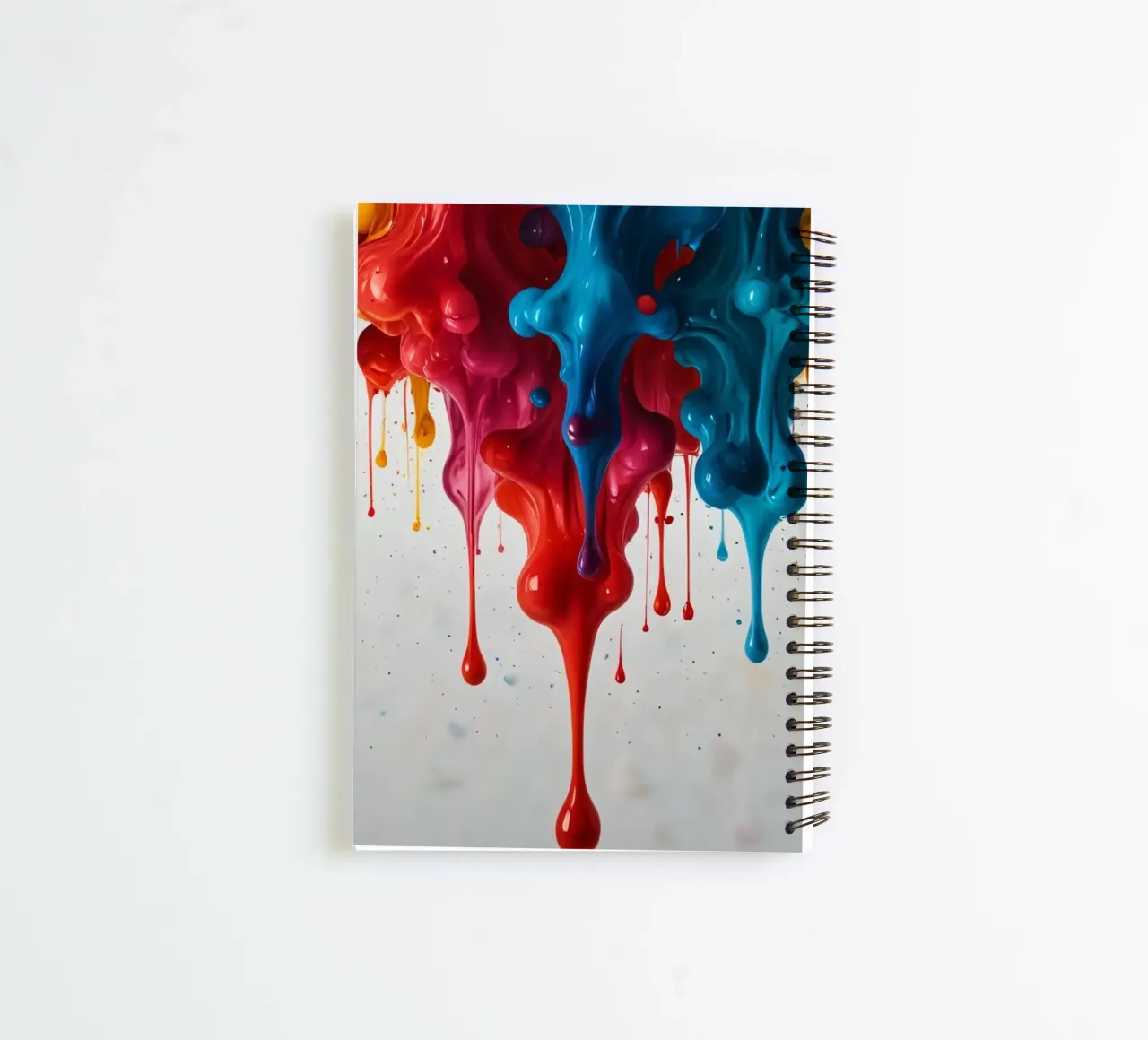 Vibrant paint drips cascading down a white surface spiral notebook by DesignDoodle
