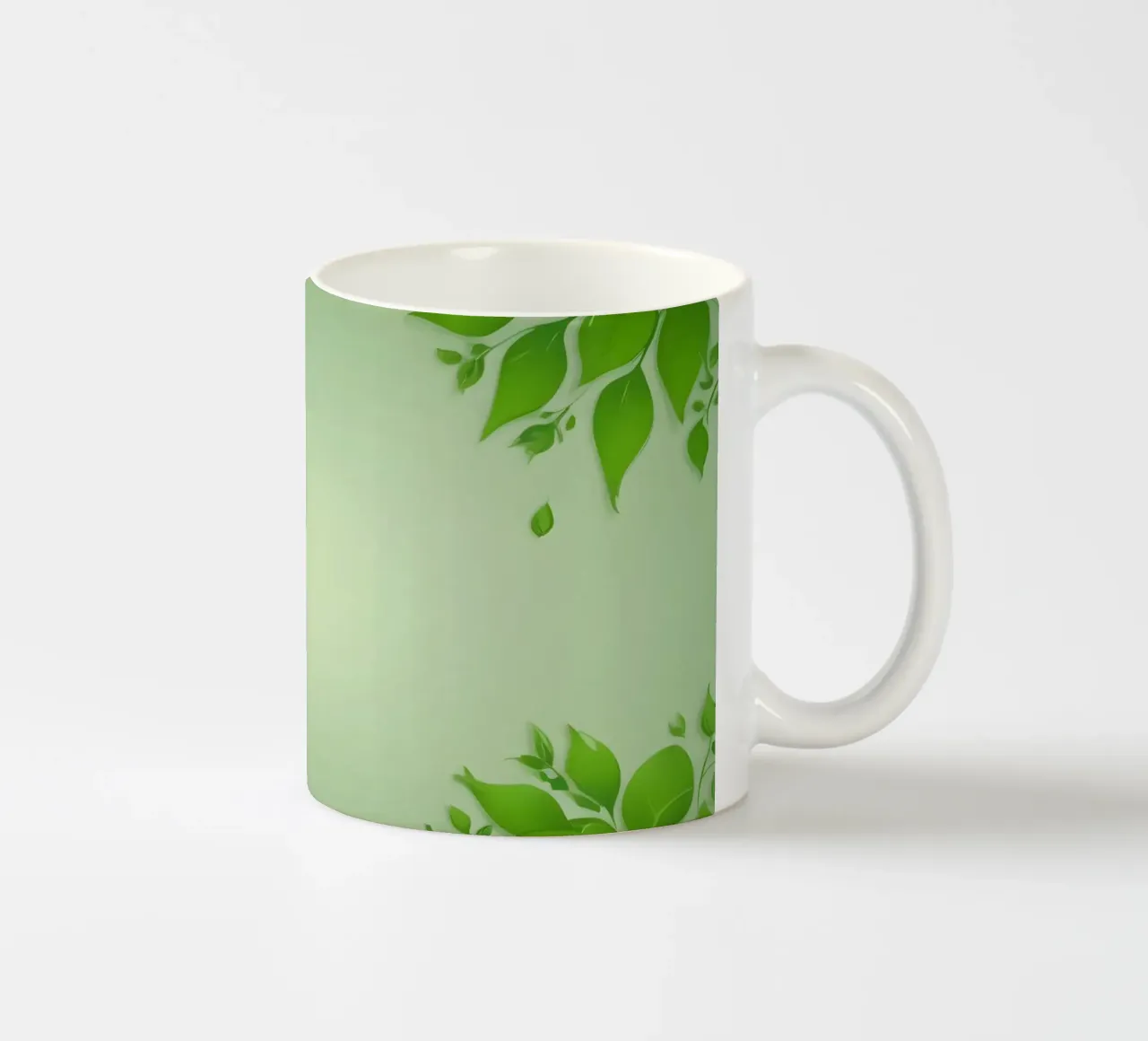 Green leaves on a soft background create a calming and fresh ceramic mug by DesignDoodle