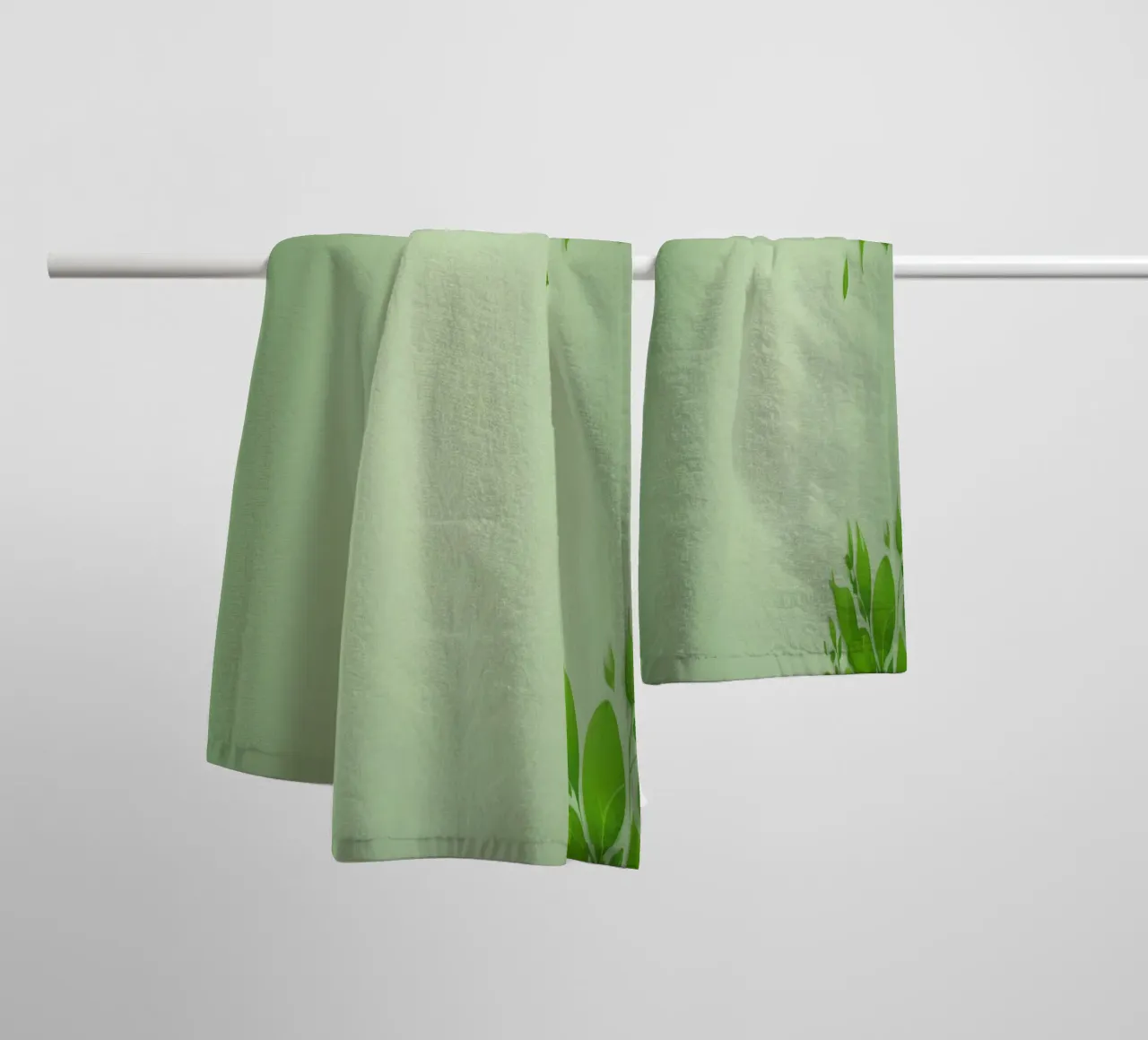 Green leaves on a soft background create a calming and fresh towel by DesignDoodle