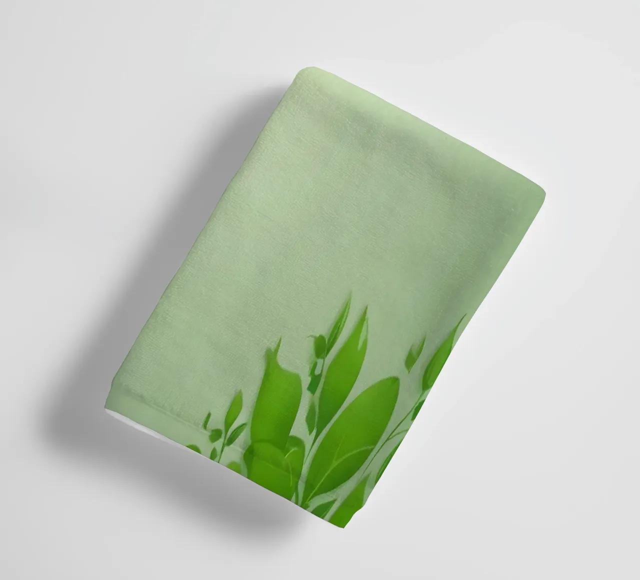 Green leaves on a soft background create a calming and fresh towel by DesignDoodle