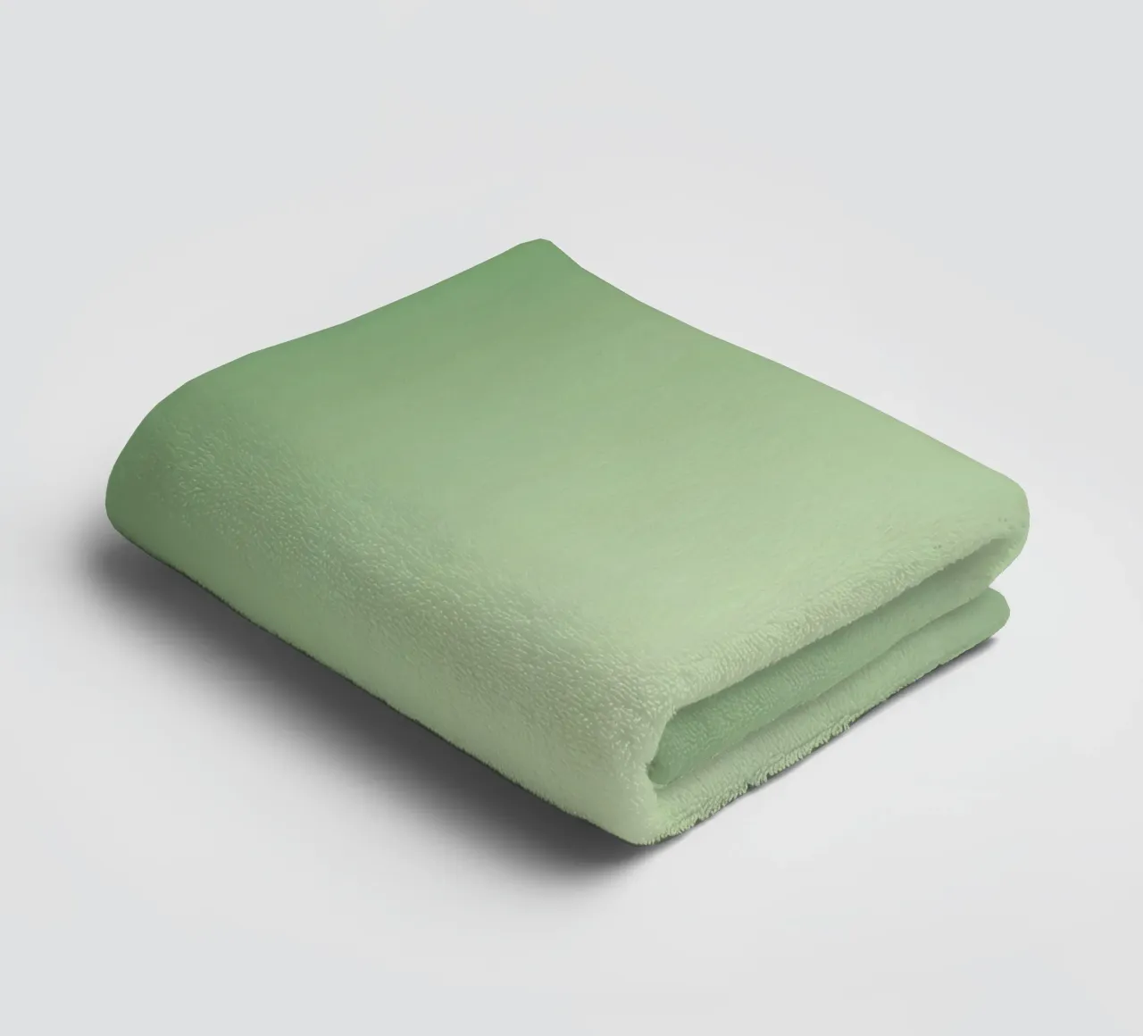 Green leaves on a soft background create a calming and fresh towel by DesignDoodle