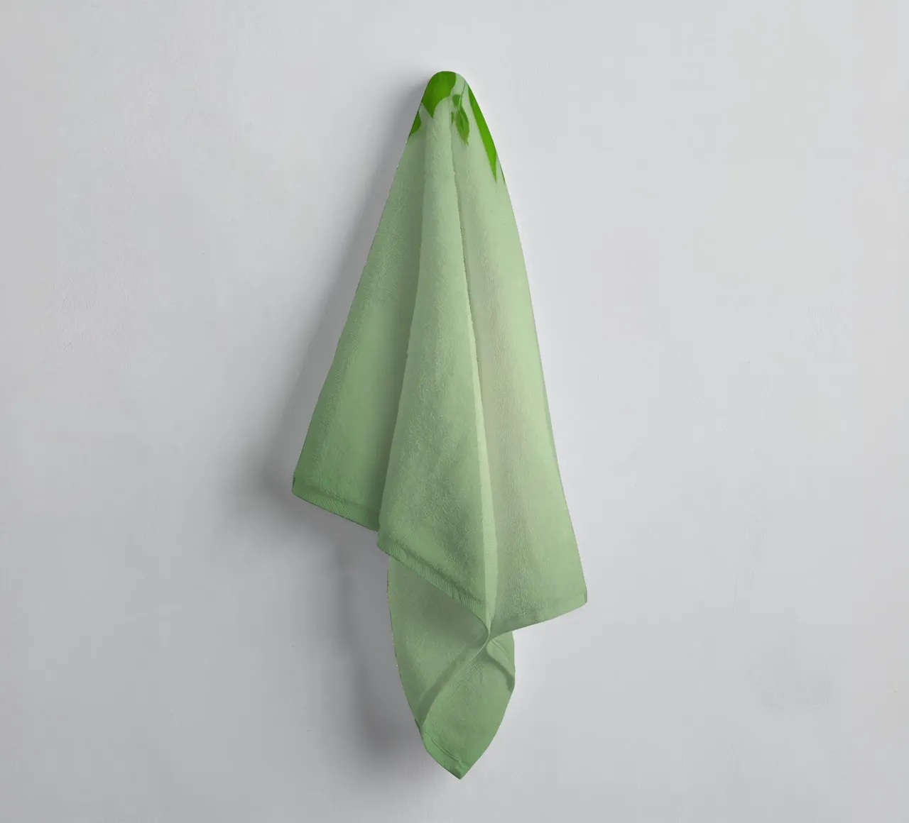 Green leaves on a soft background create a calming and fresh towel by DesignDoodle