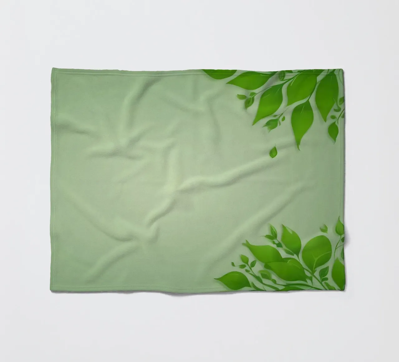 Green leaves on a soft background create a calming and fresh fleece blanket by DesignDoodle
