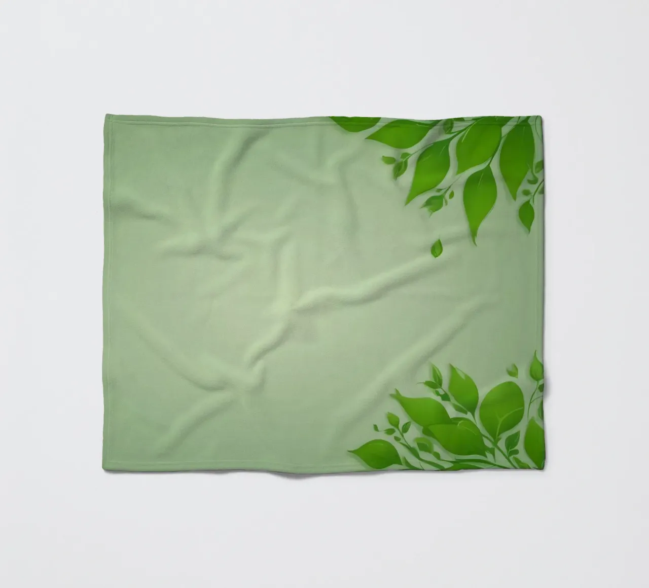 Green leaves on a soft background create a calming and fresh fleece blanket by DesignDoodle