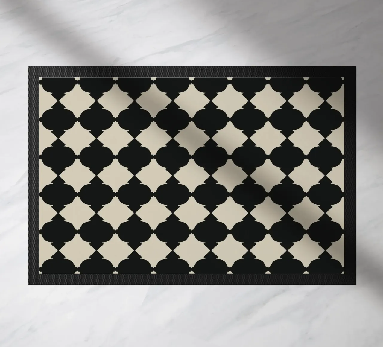 Repeating black grid doormat by Little Dean