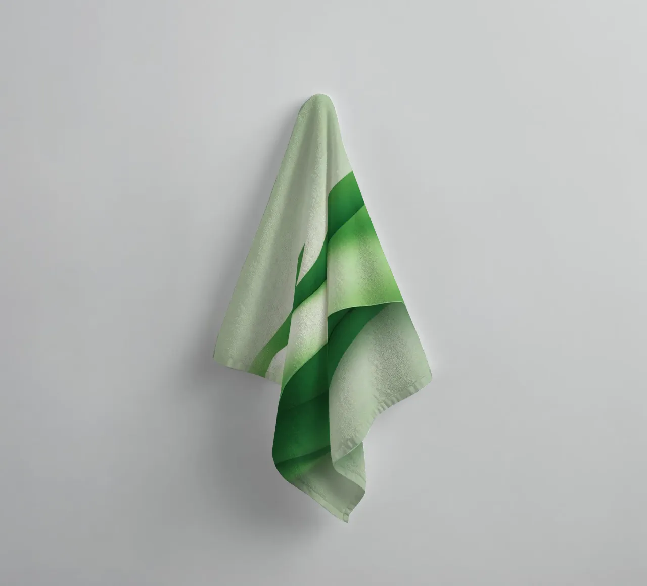 Curved green shapes ripple in an abstract design towel by DesignDoodle