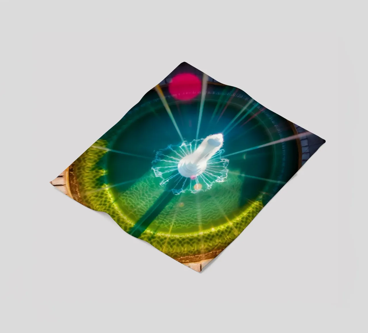 vista aerea di una fontana con riflessi di luce colorati coperta in pile da DesignDoodle