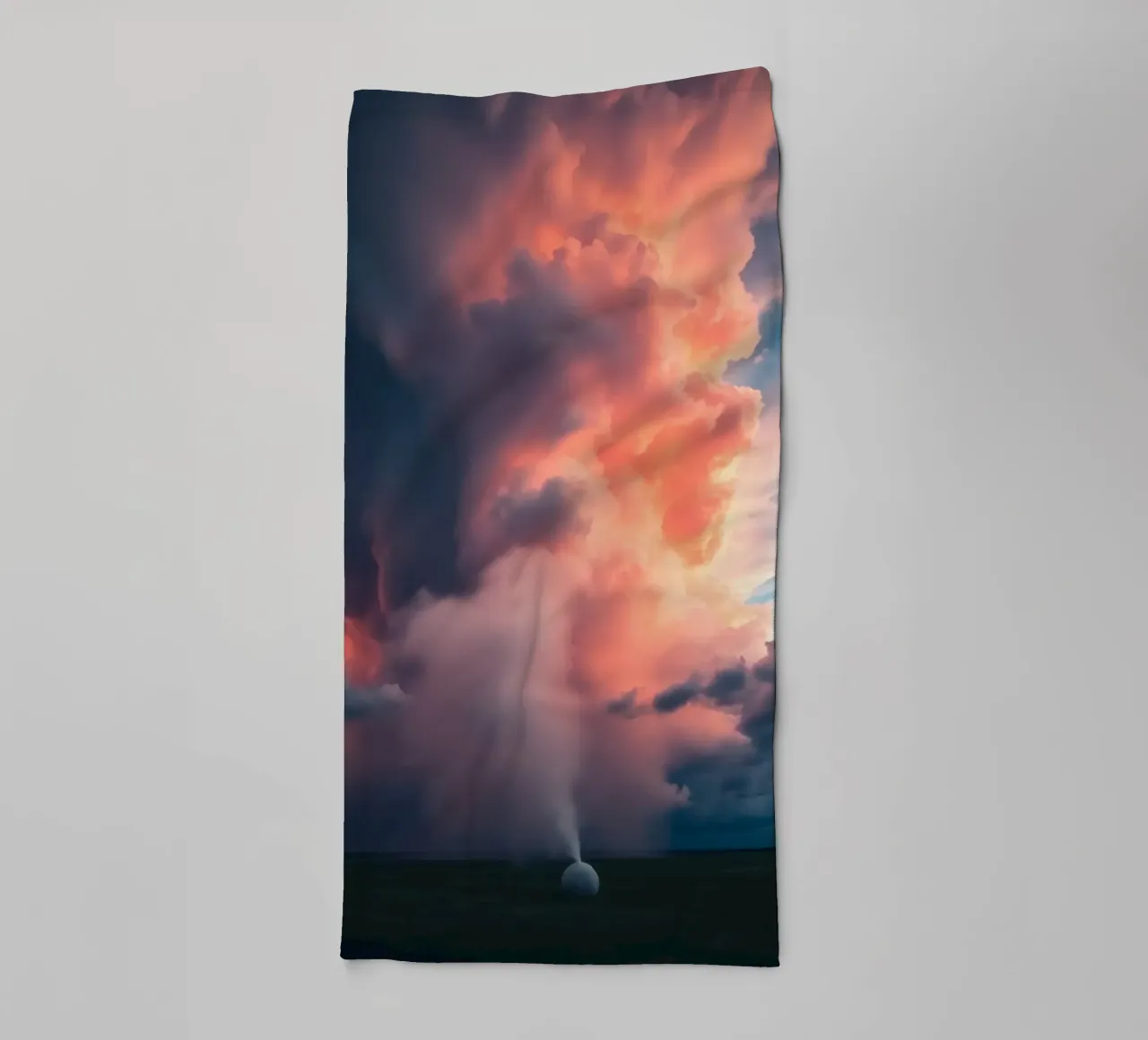 Dramatic storm clouds illuminated by sunset over a field towel by DesignDoodle