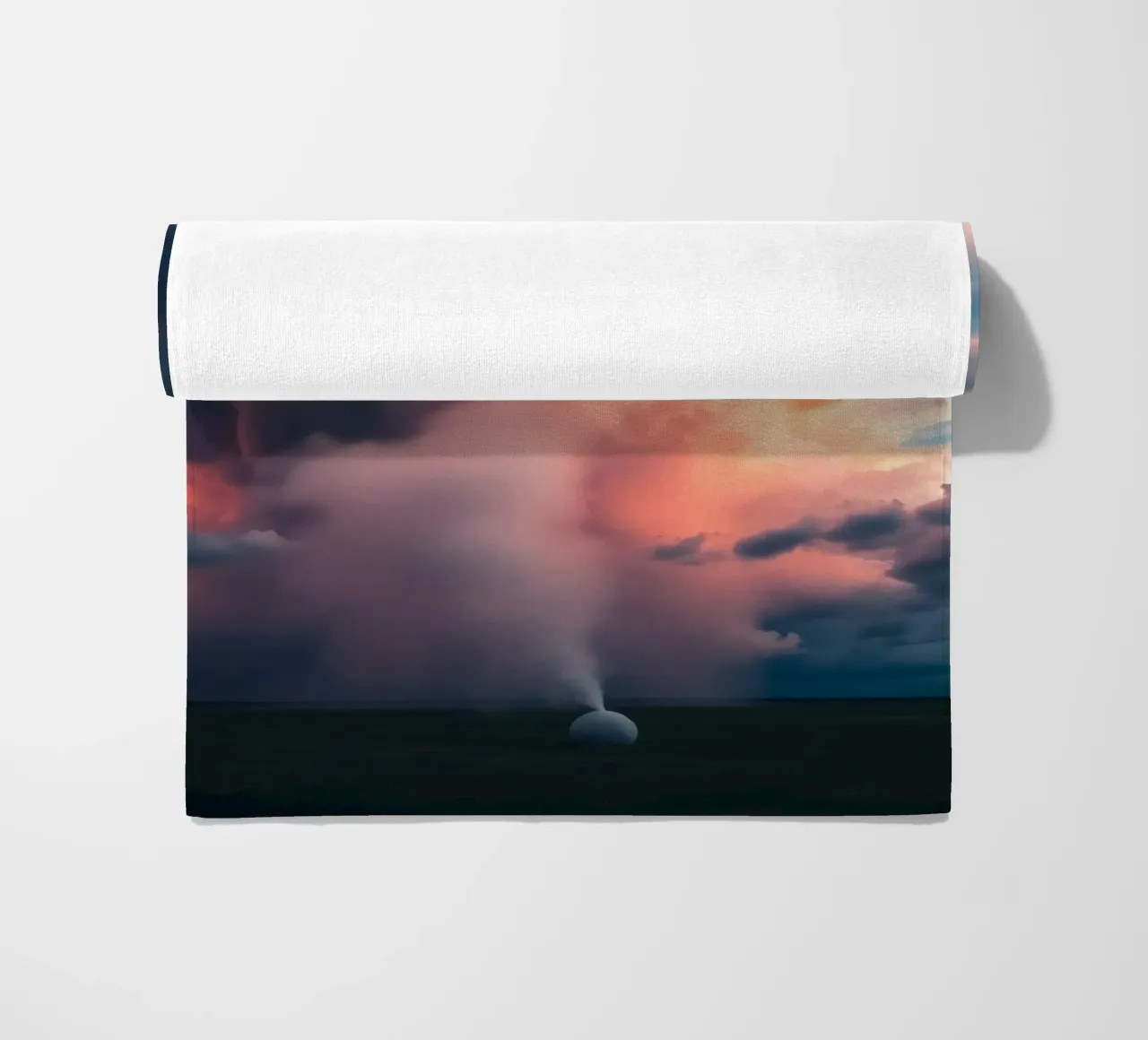Dramatic storm clouds illuminated by sunset over a field beach towel by DesignDoodle