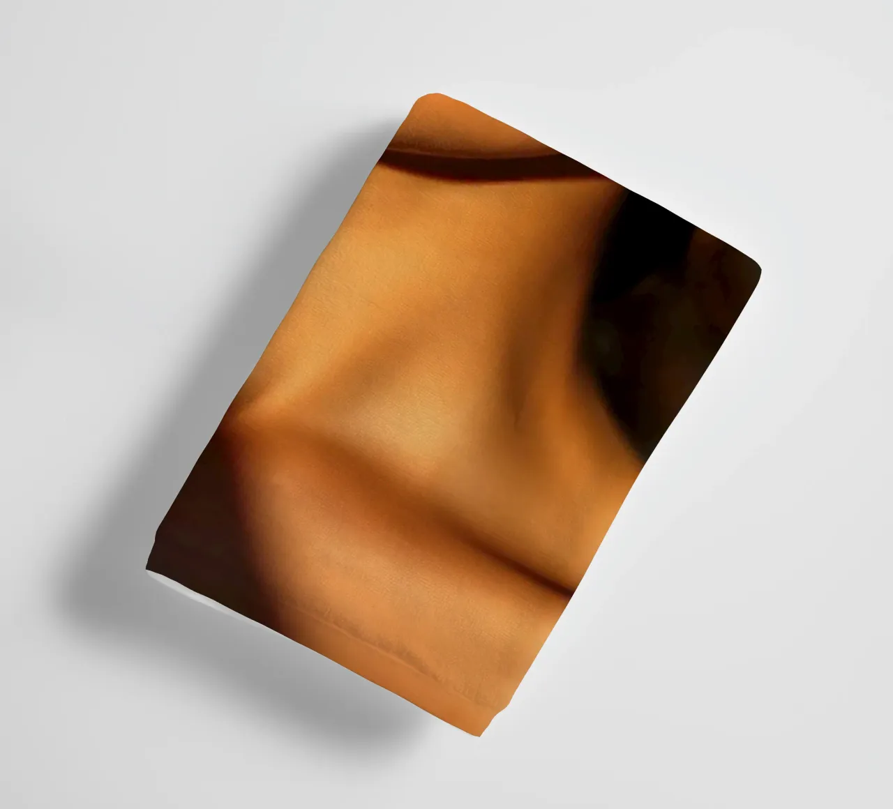 Sunlight casts dramatic shadows on a woman's face towel by DesignDoodle