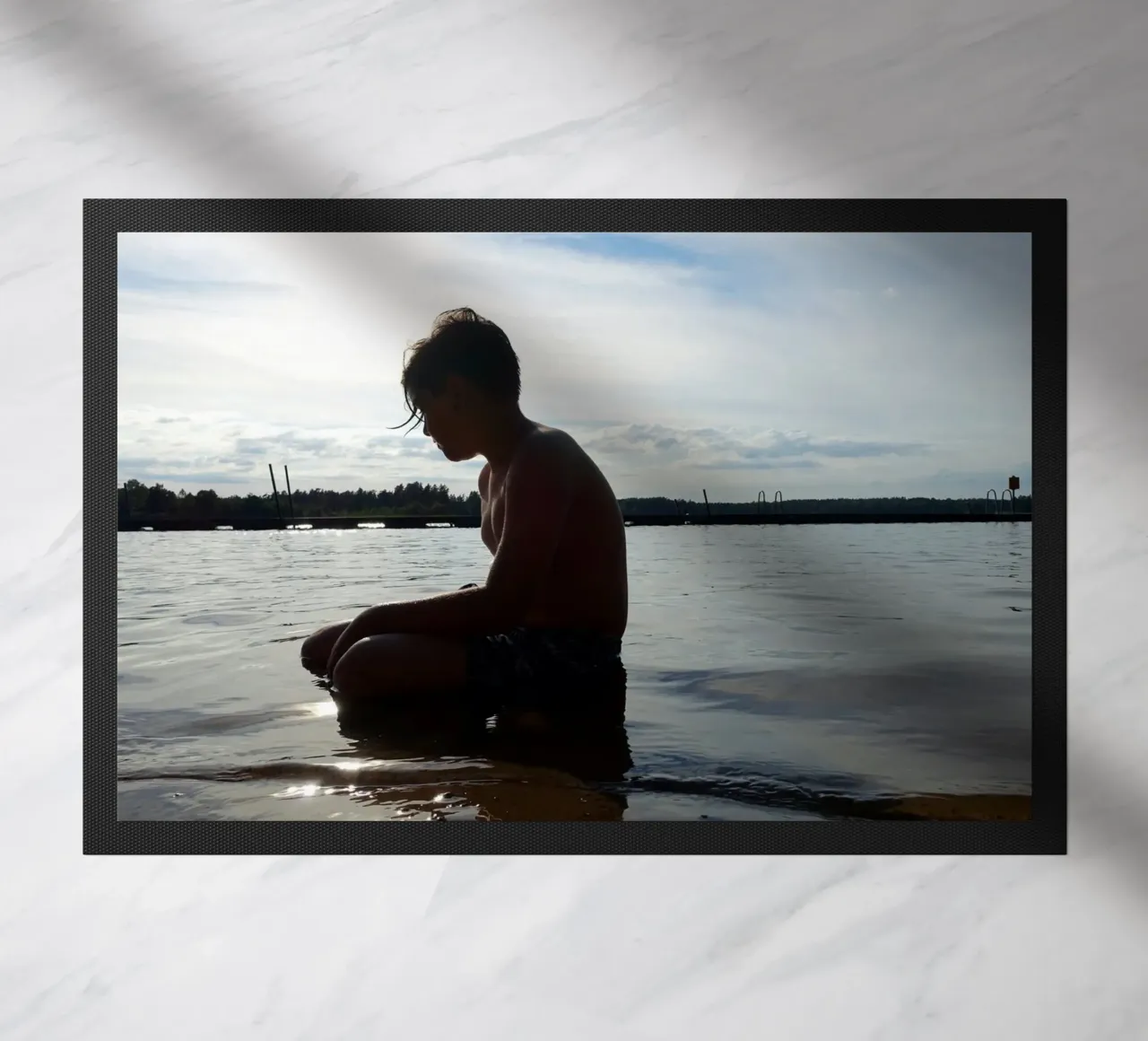 A boy doormat by Massimo Frascogna