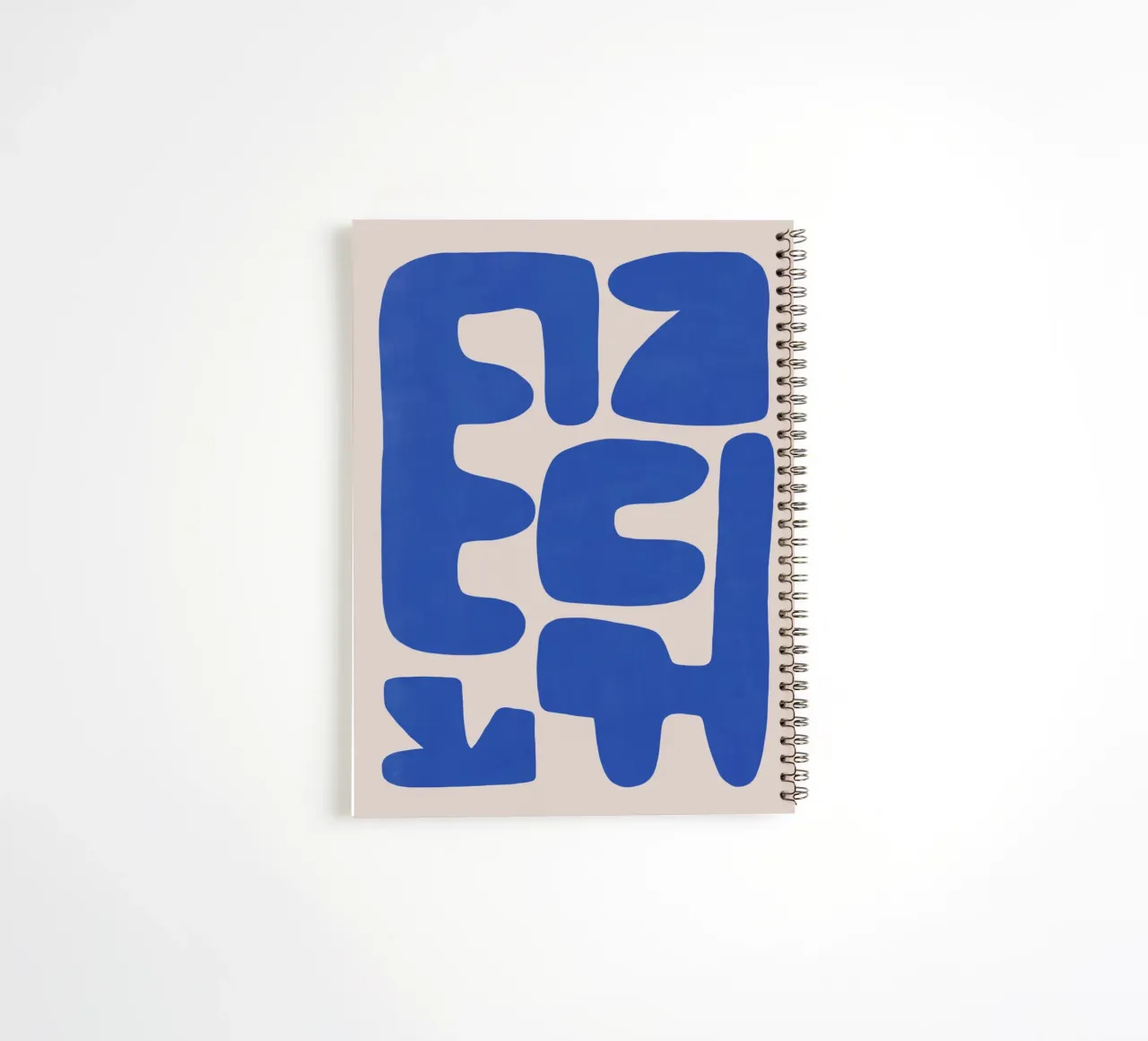 Irregular shape arrangement in blue spiral notebook by Little Dean