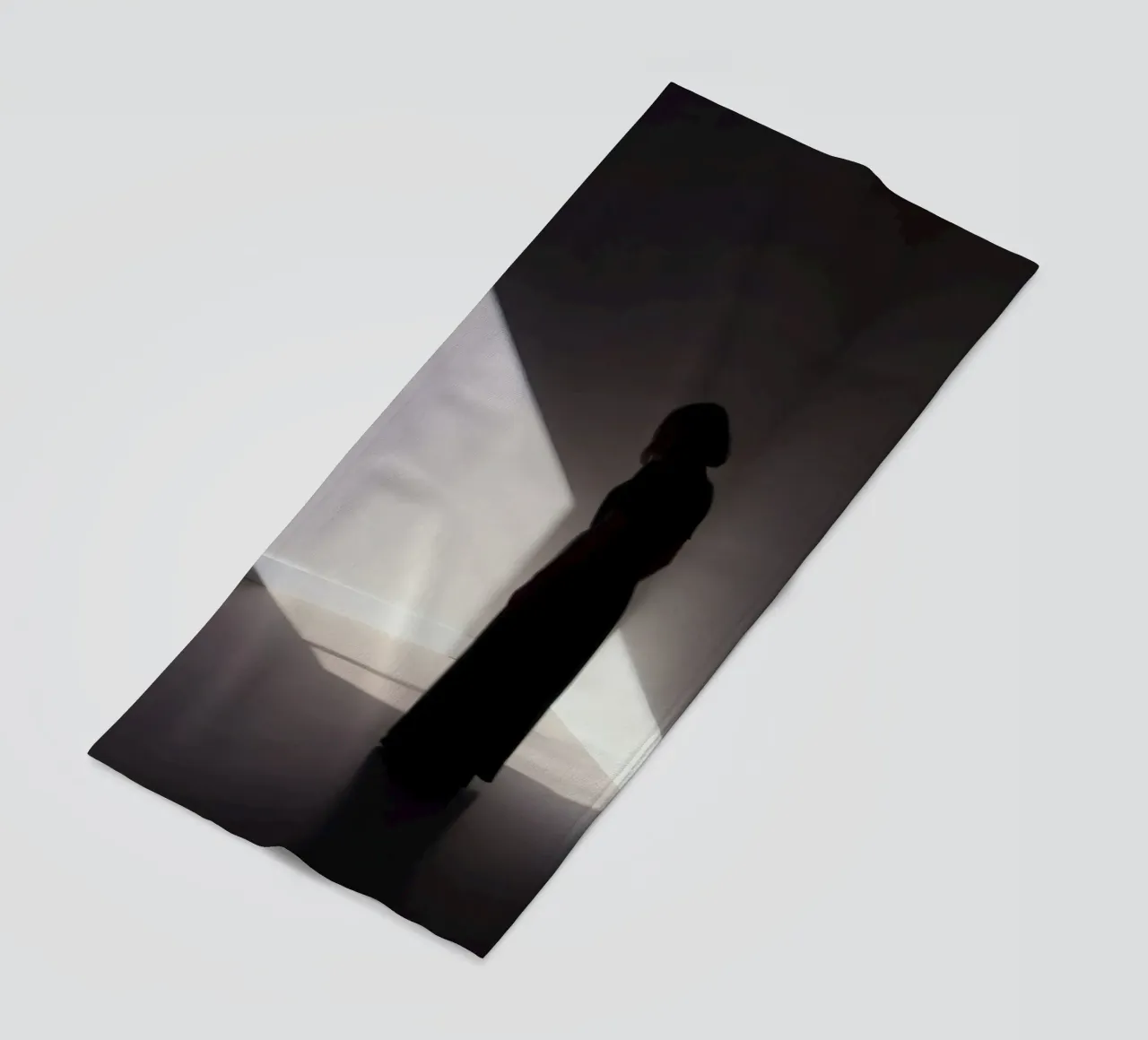 Woman standing in shadow creepy light casting beach towel by DesignDoodle