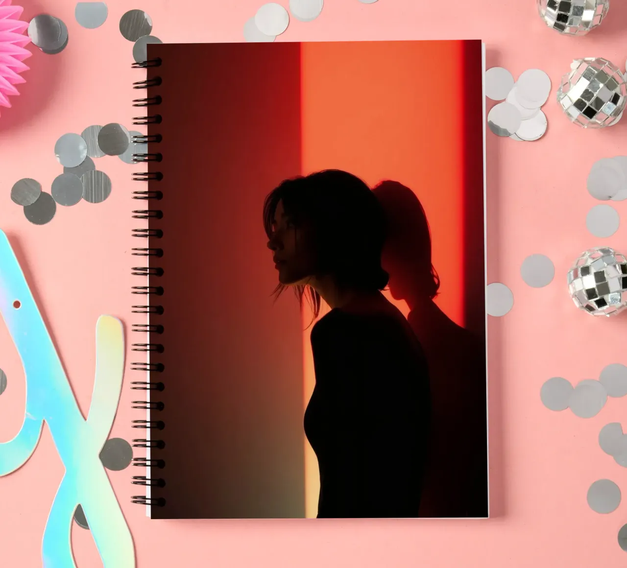 Silhouette of a woman in dim light with colorful background spiral notebook by DesignDoodle
