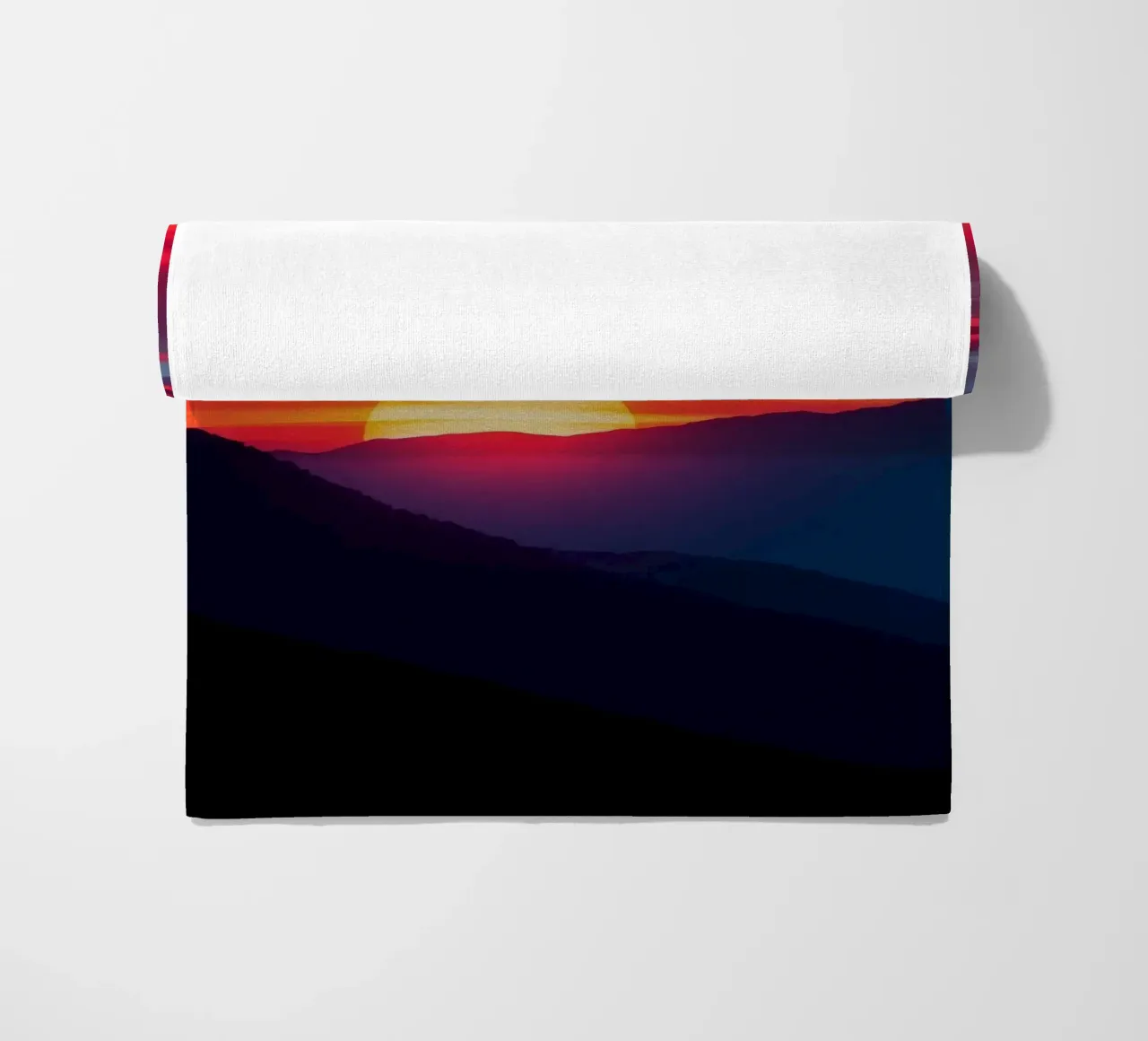Sunset over mountain range, clouds and tranquil scene beach towel by DesignDoodle