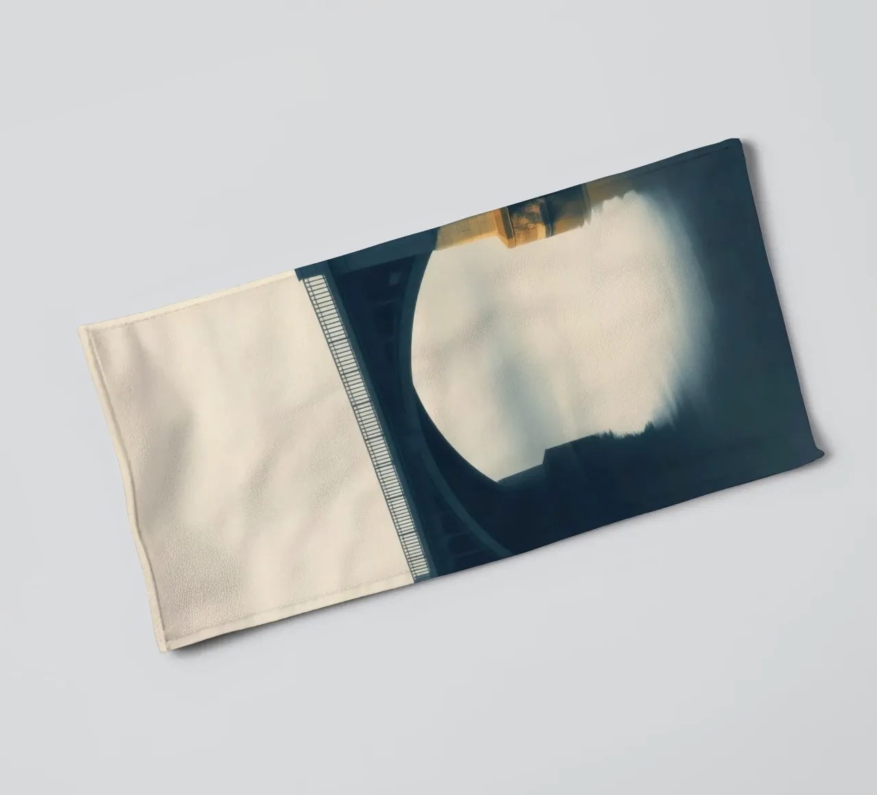 Bridge shrouded in fog reflecting on still waters at dawn towel by DesignDoodle