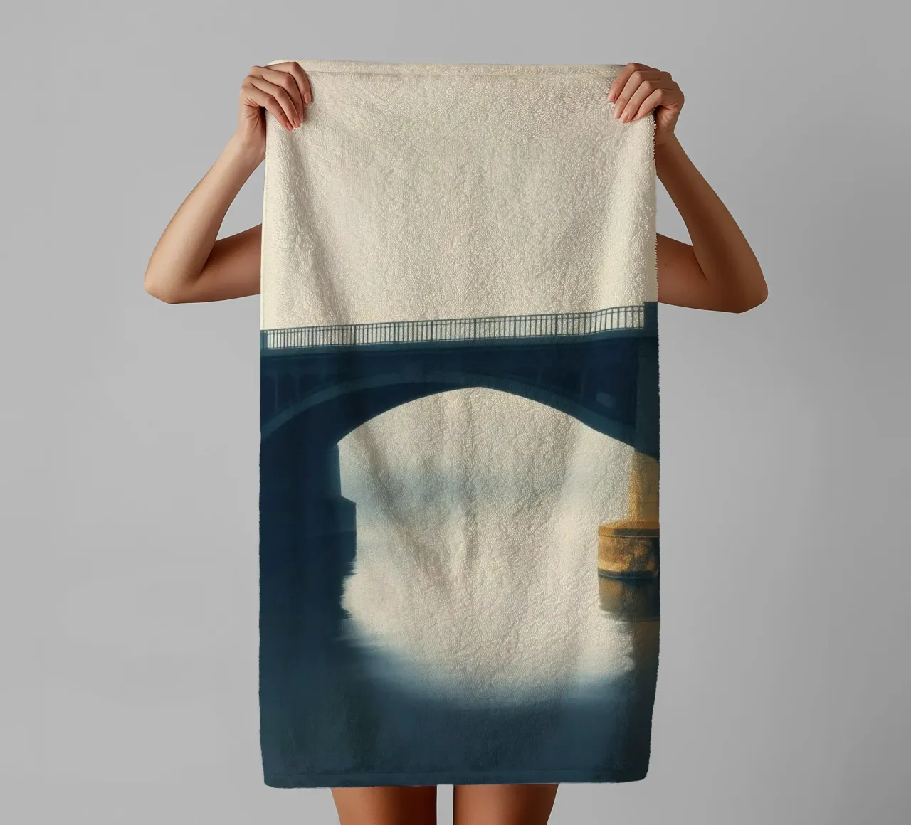 Bridge shrouded in fog reflecting on still waters at dawn towel by DesignDoodle