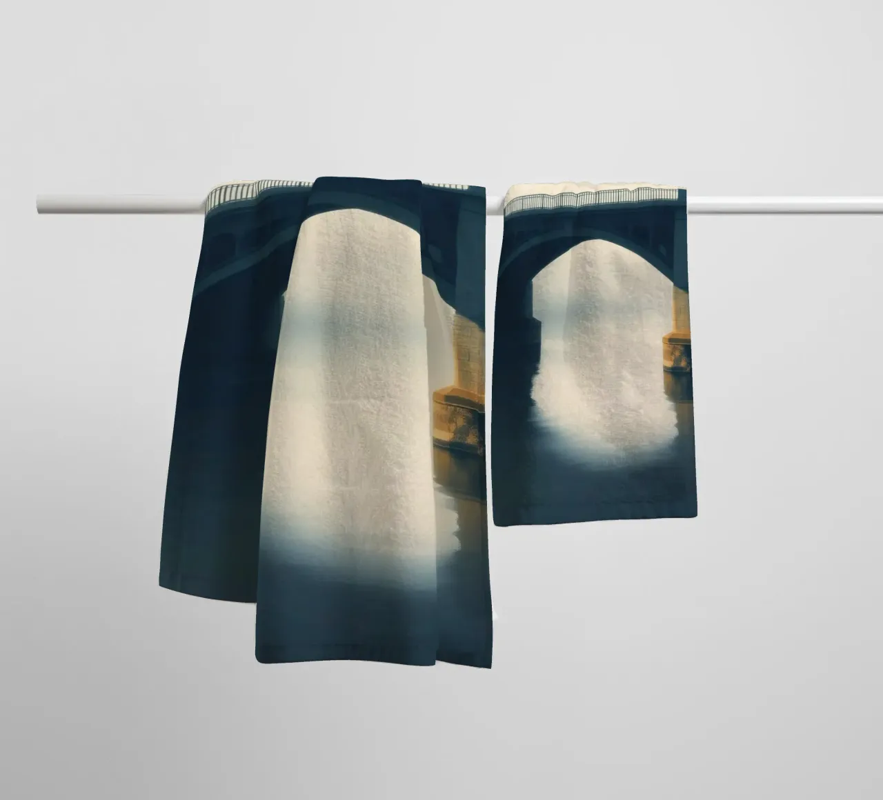 Bridge shrouded in fog reflecting on still waters at dawn towel by DesignDoodle
