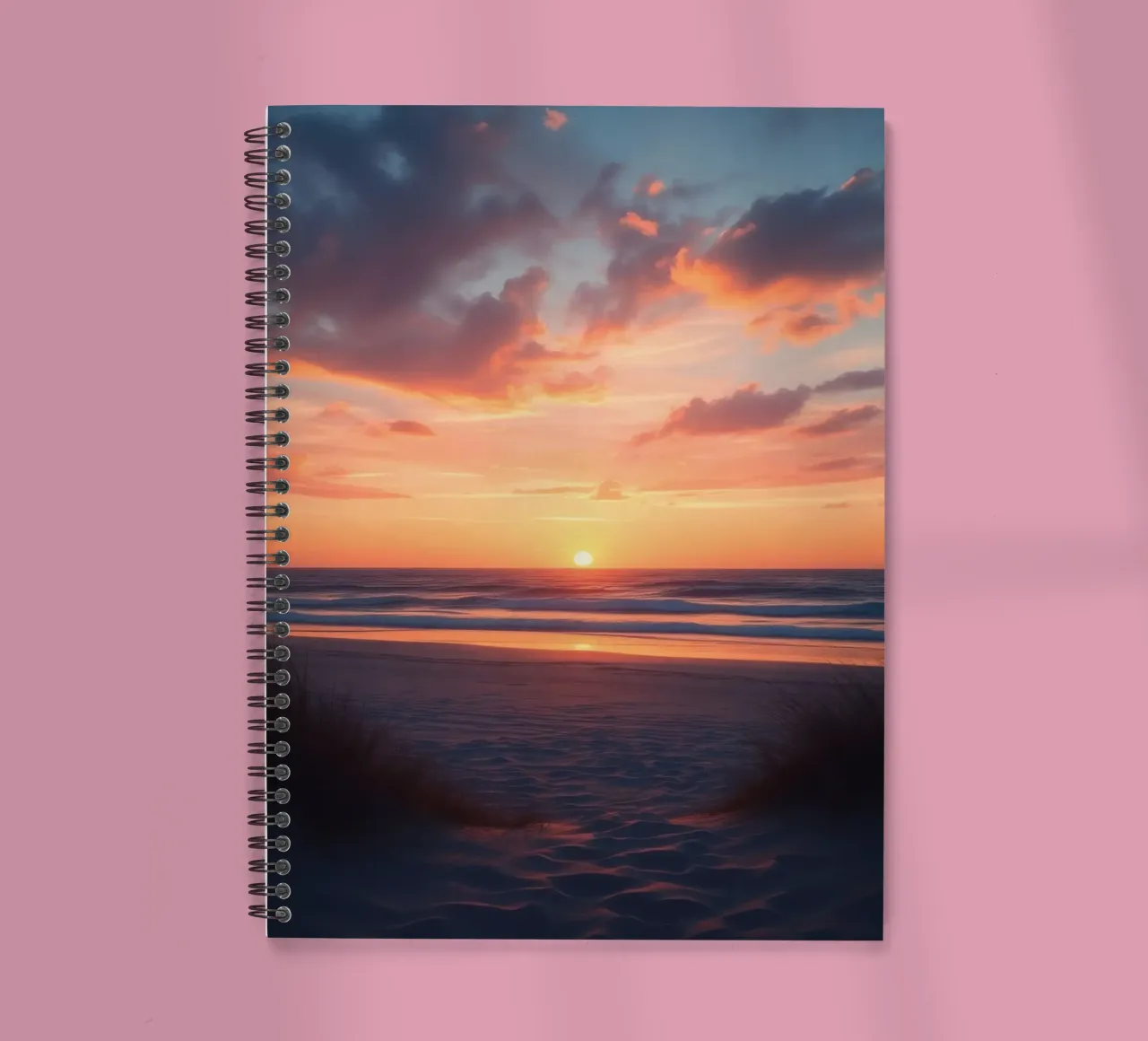 sunset descends over a tranquil beach with gentle waves spiral notebook by DesignDoodle