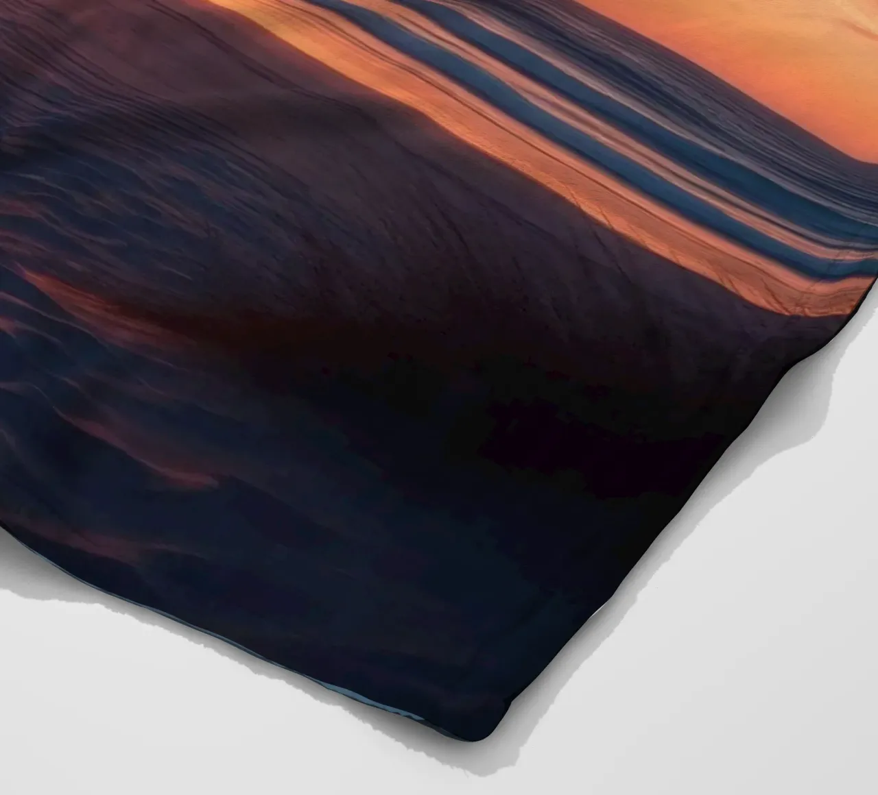 sunset descends over a tranquil beach with gentle waves fleece blanket by DesignDoodle