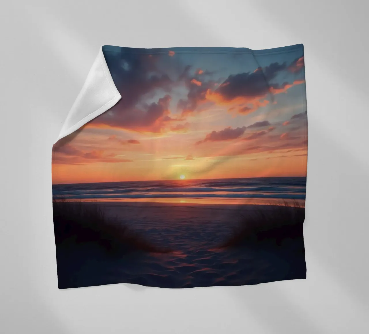 sunset descends over a tranquil beach with gentle waves fleece blanket by DesignDoodle