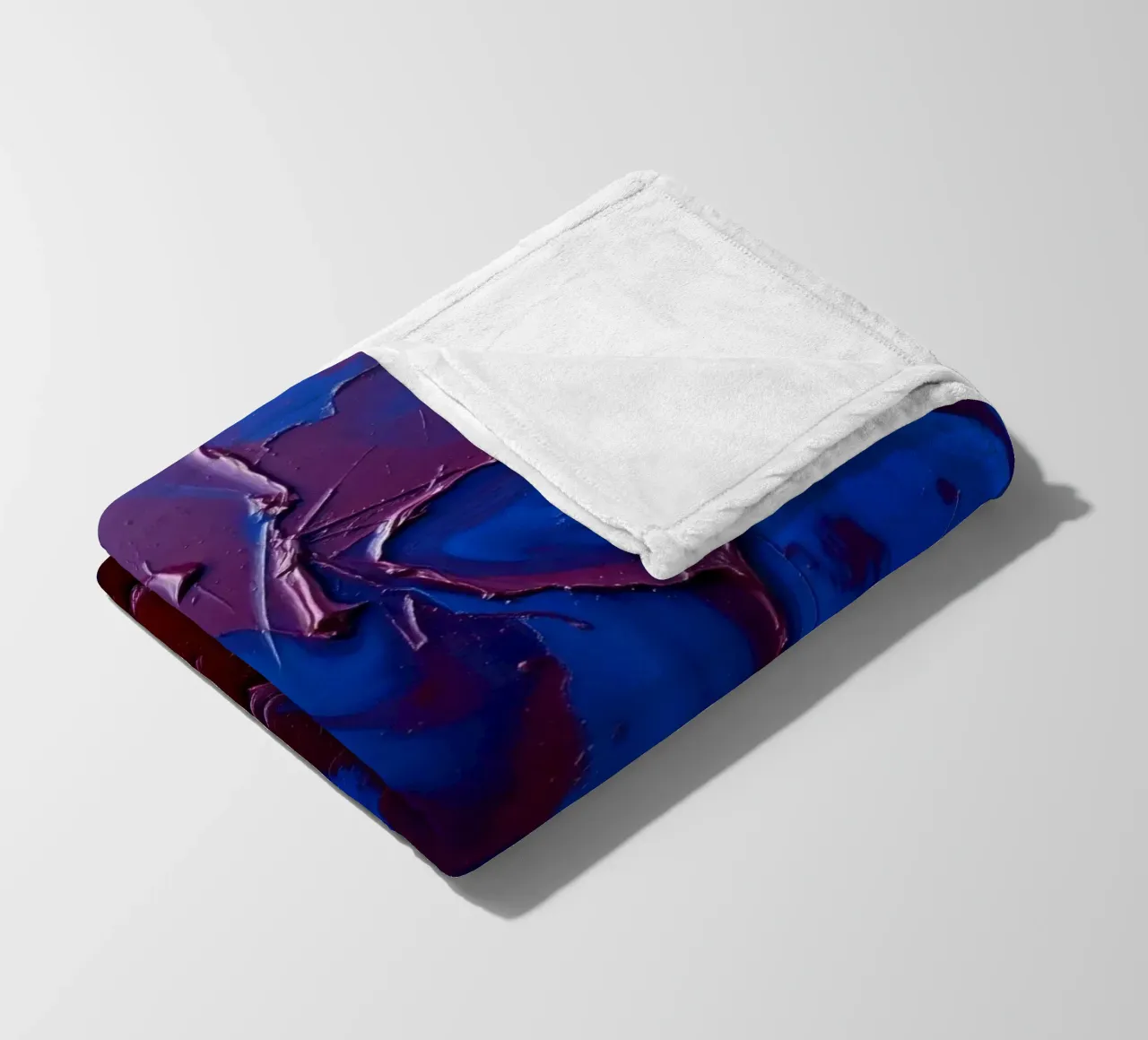 Abstract art piece with textured layers of blue and maroon fleece blanket by DesignDoodle