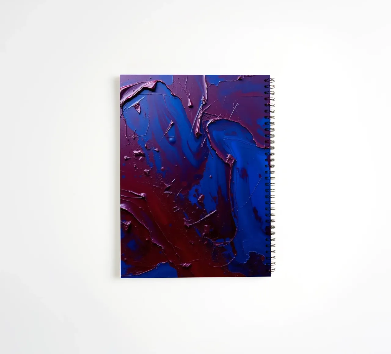 Abstract art piece with textured layers of blue and maroon spiral notebook by DesignDoodle