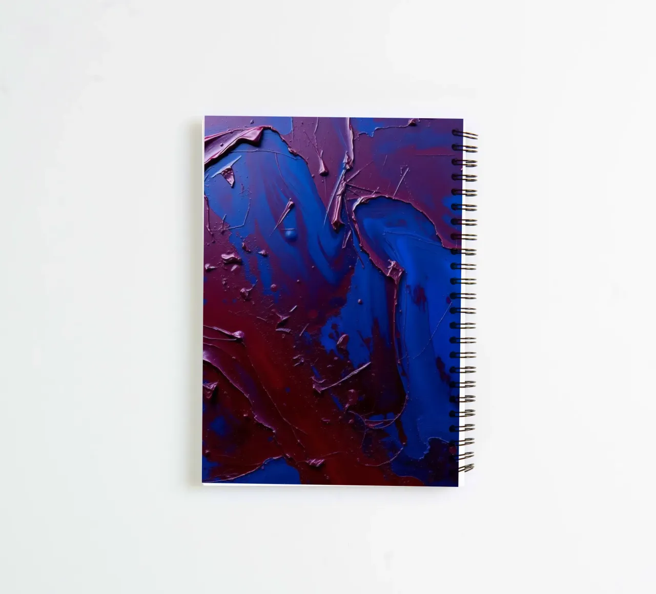 Abstract art piece with textured layers of blue and maroon spiral notebook by DesignDoodle