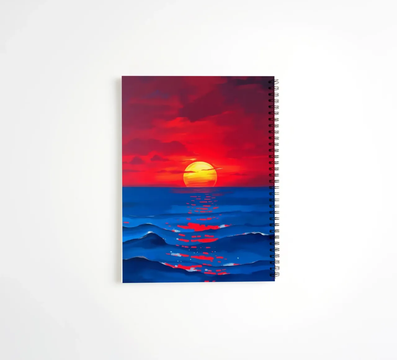 Vibrant sunset over calm ocean waves creating a serene spiral notebook by DesignDoodle