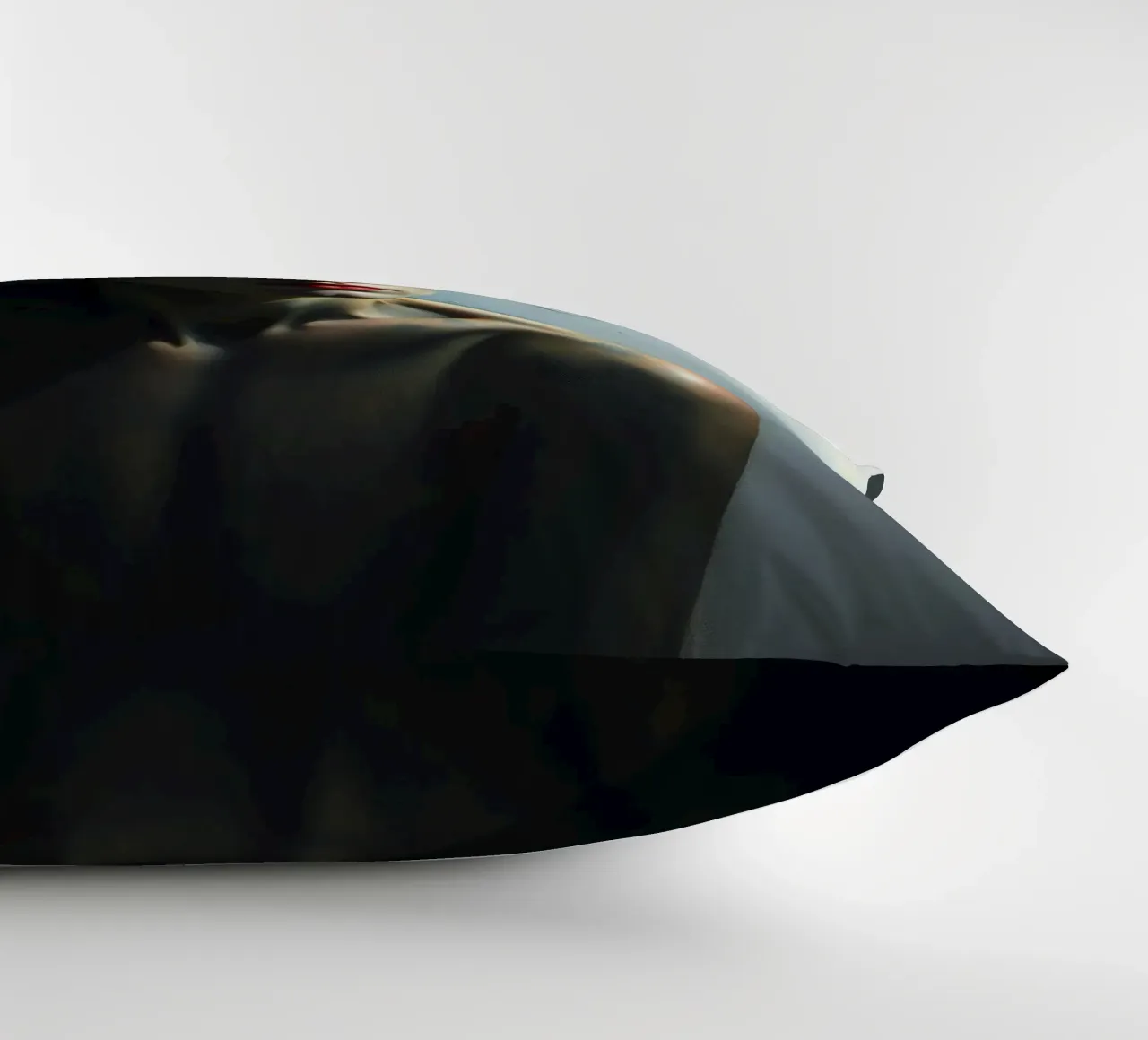 Expression of vulnerability and contemplation in a dimly lit decorative cushion by DesignDoodle