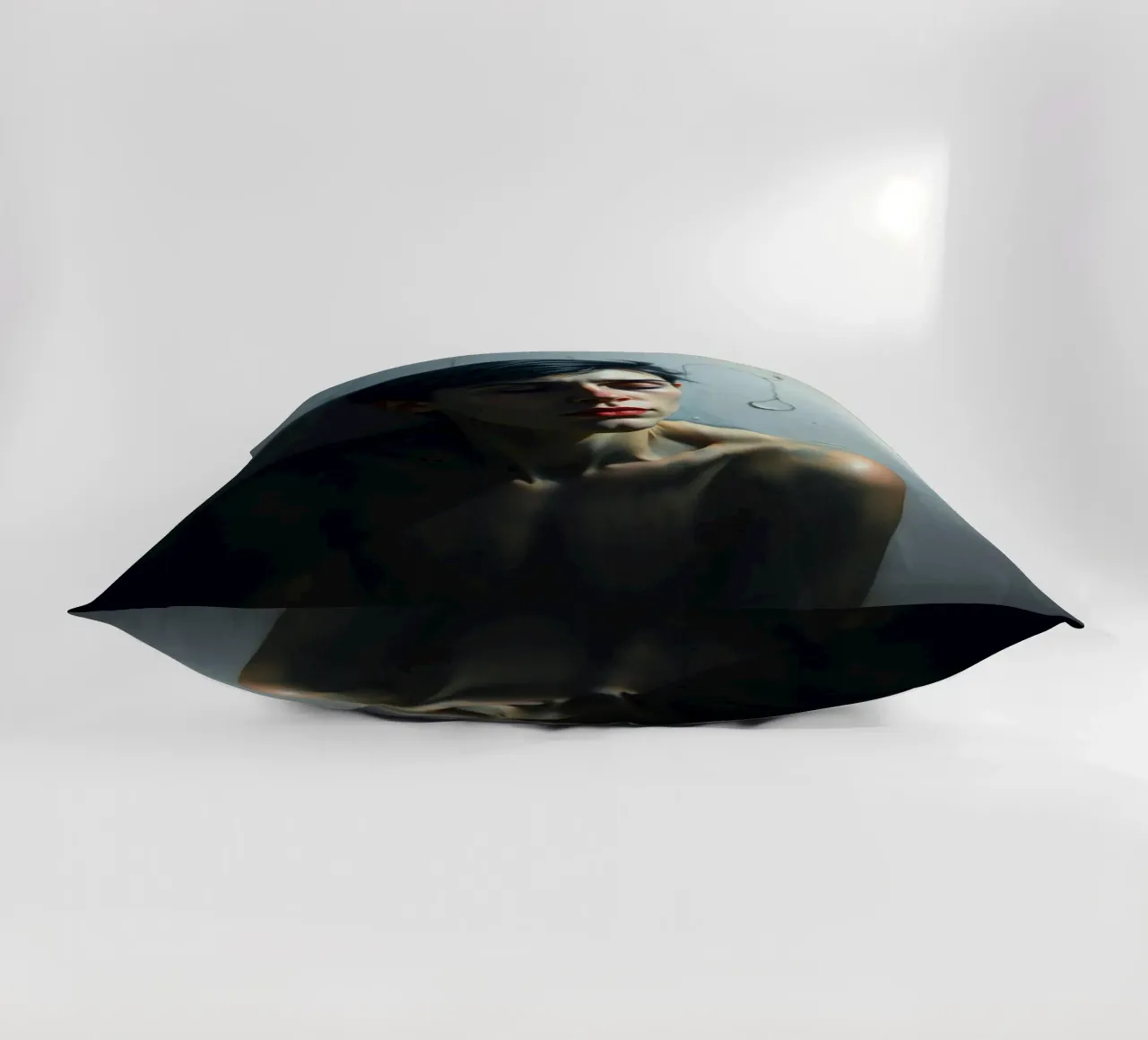 Expression of vulnerability and contemplation in a dimly lit decorative cushion by DesignDoodle