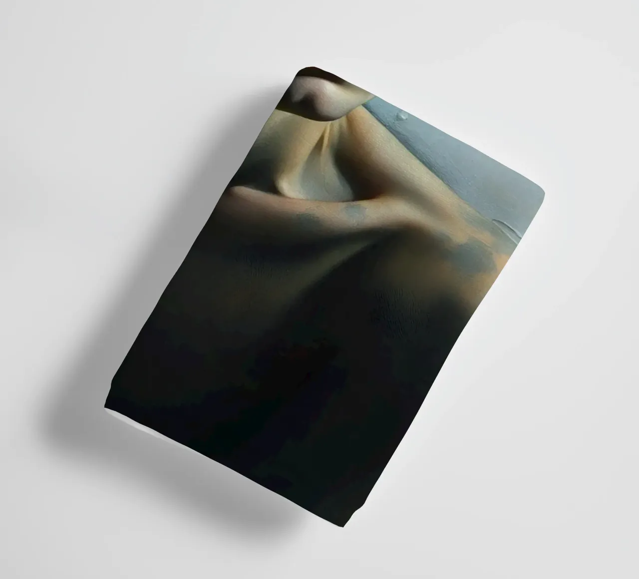 Expression of vulnerability and contemplation in a dimly lit towel by DesignDoodle