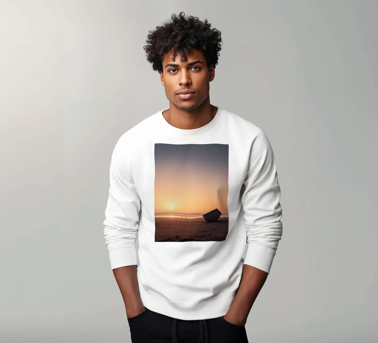 Sunset view with a lone boat on a tranquil beach showcasing sweatshirt by DesignDoodle