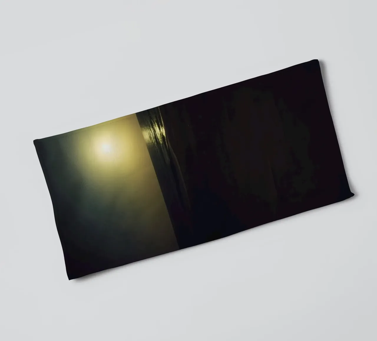 Moonlit beach night with shimmering water under a clear sky towel by DesignDoodle