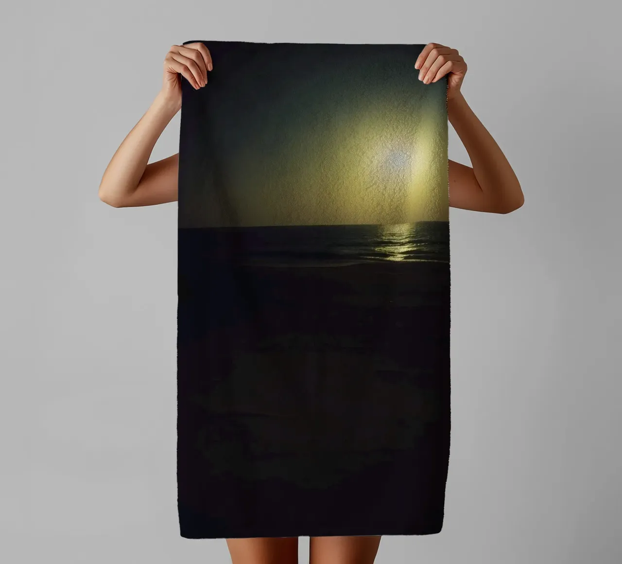 Moonlit beach night with shimmering water under a clear sky towel by DesignDoodle