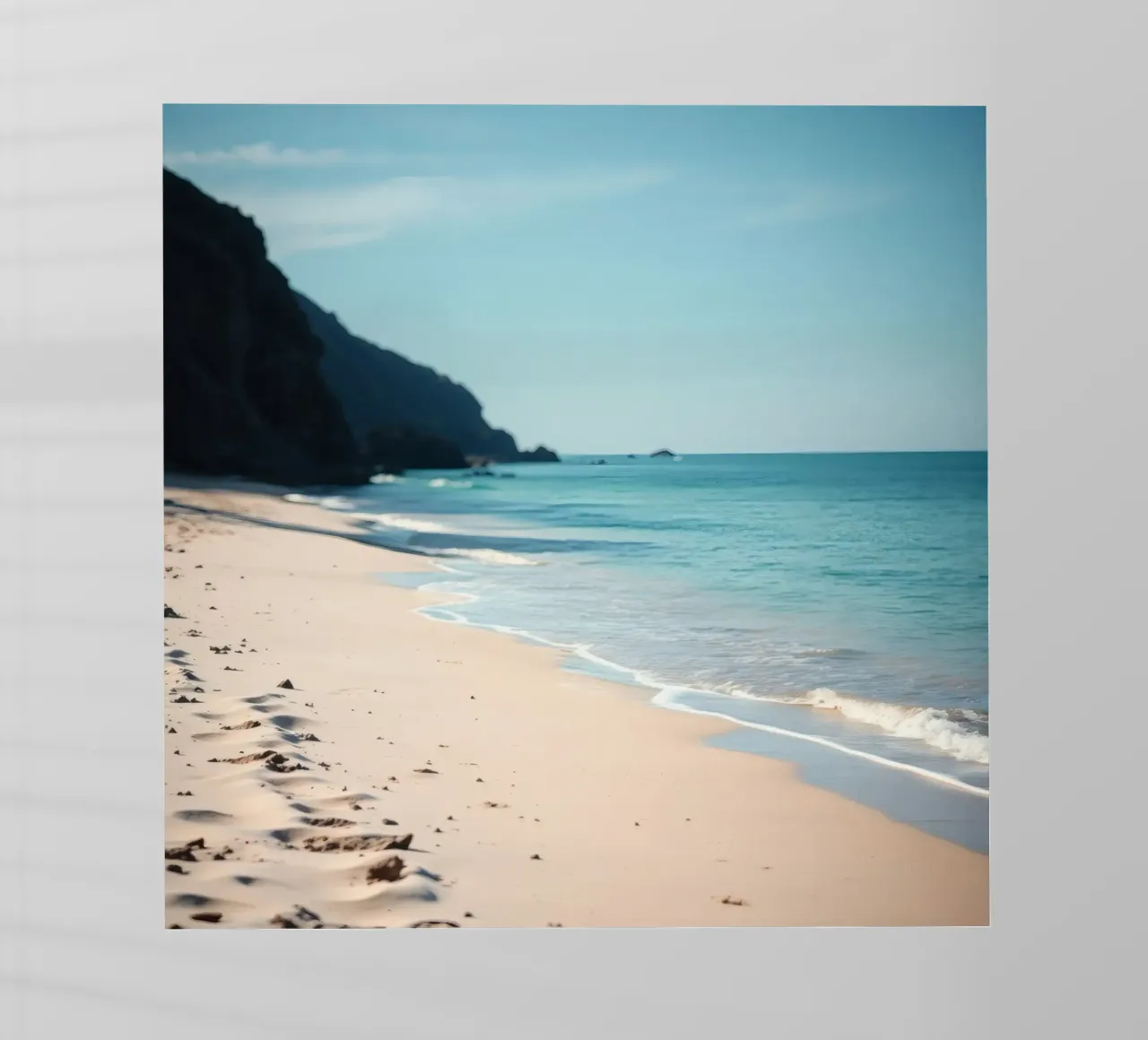 Serene coastline with soft waves lapping against pristine backlit film by DesignDoodle