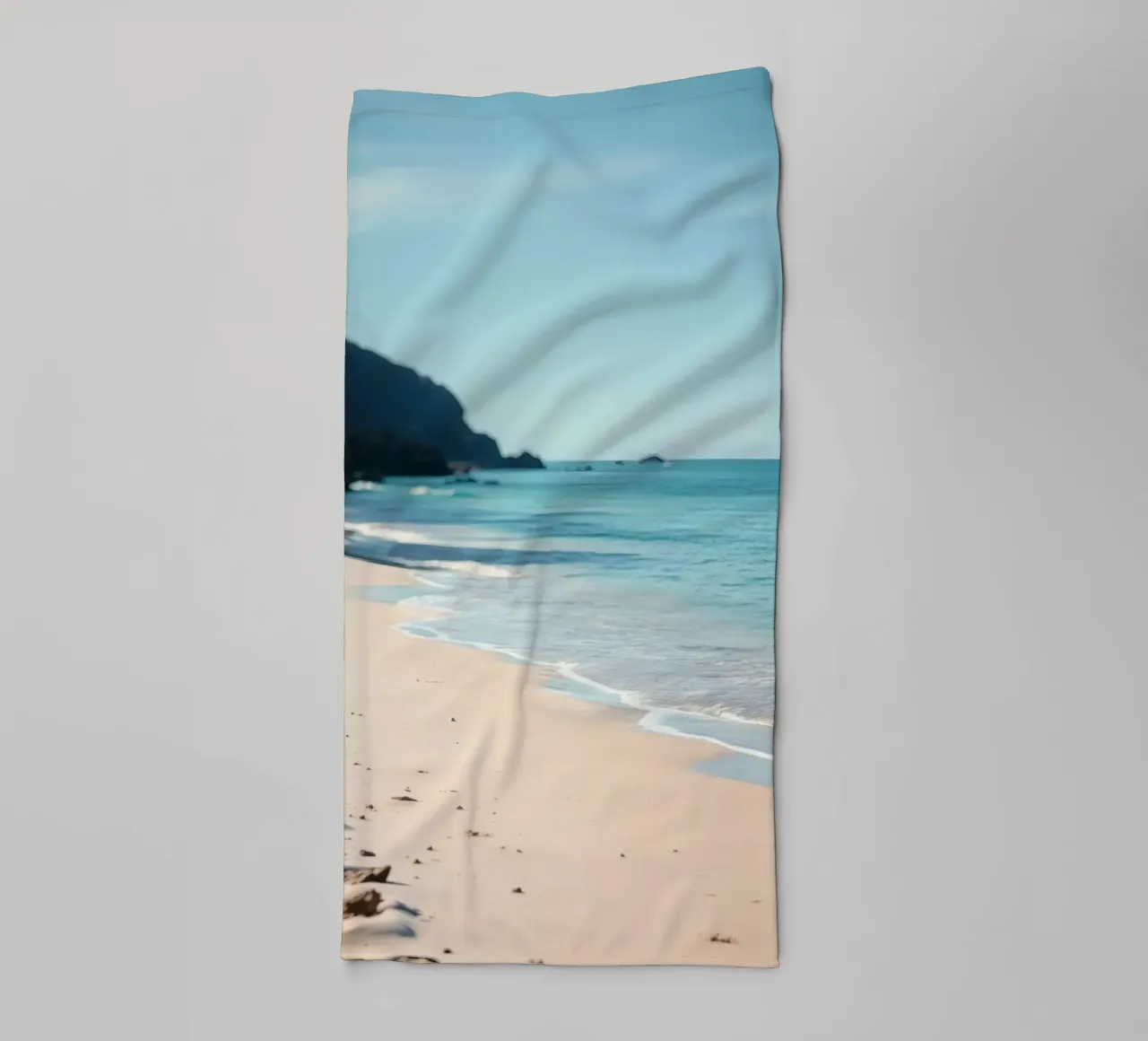 Serene coastline with soft waves lapping against pristine towel by DesignDoodle